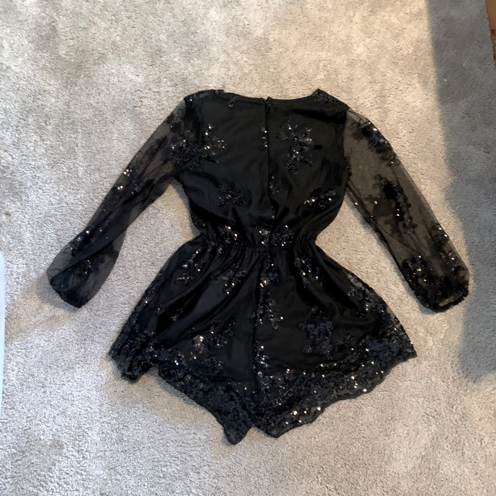 Brand Reverse size M, black sequin romper Never been worn but does not have tags